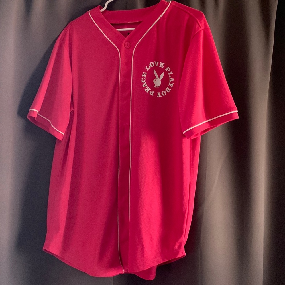 Pink playboy jersey. Size medium has buttons.Very cute !!